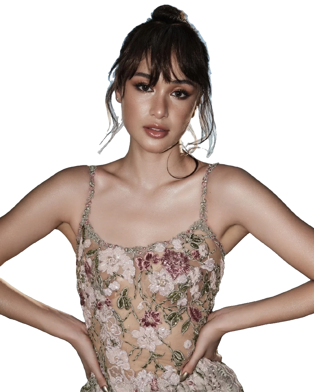 Nicole Borromeo in a floral embroidered corset, hands on hips
