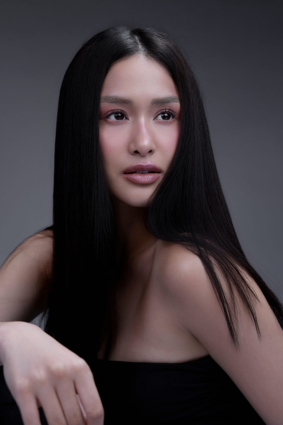Close-up portrait over a bare shoulder